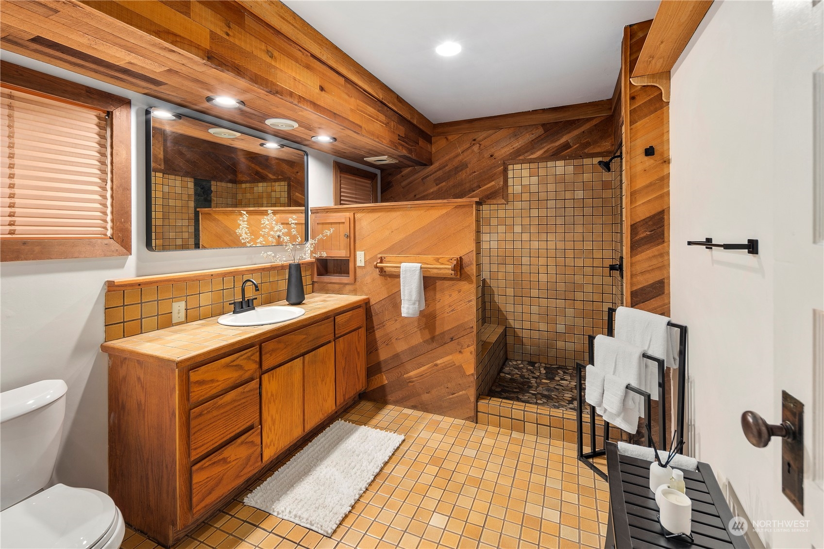 417 Ave H Snohomish, WA 98290 - Photo 16 of 37 a bathroom with a sink mirror vanity and toilet
