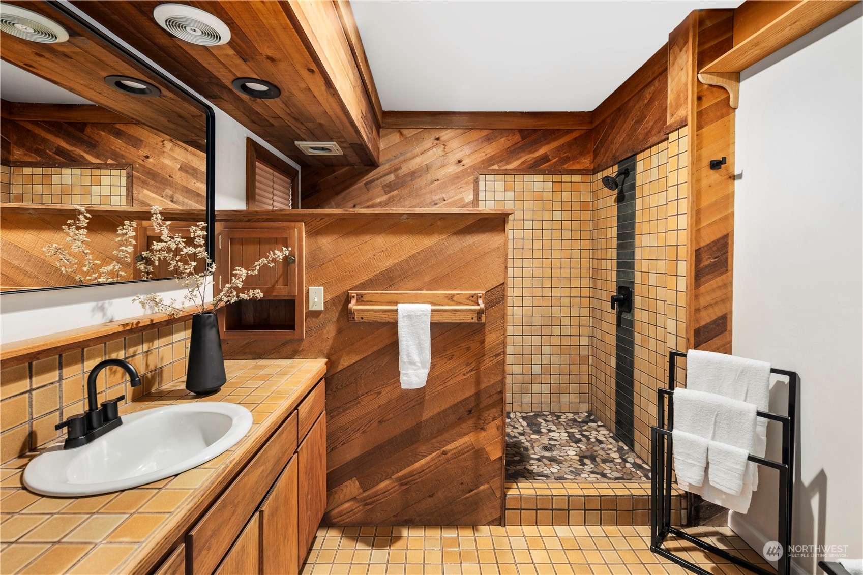 417 Ave H Snohomish, WA 98290 - Photo 17 of 37 a bathroom with a sink and a mirror