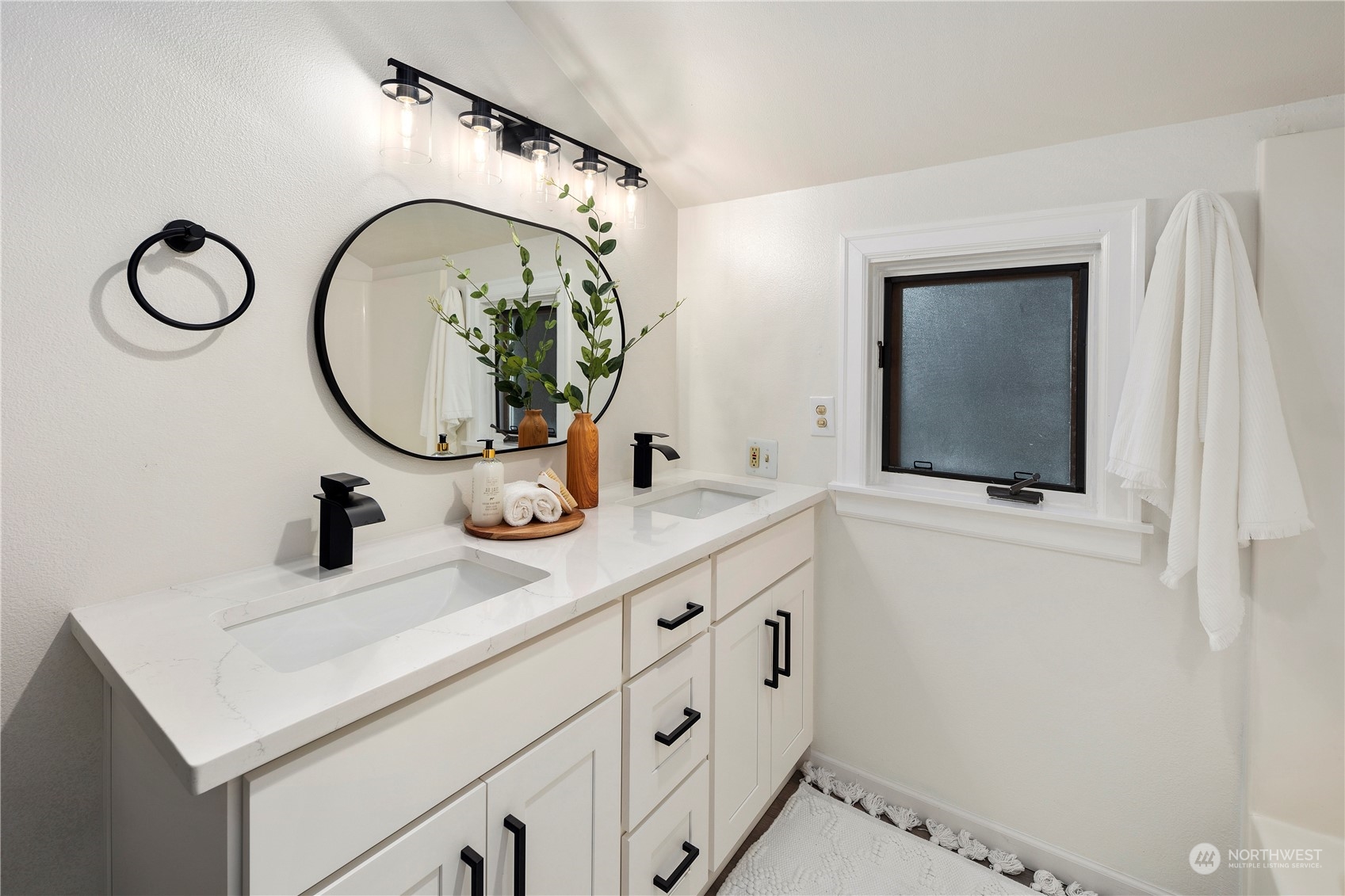417 Ave H Snohomish, WA 98290 - Photo 20 of 37 a bathroom with a sink and a mirror