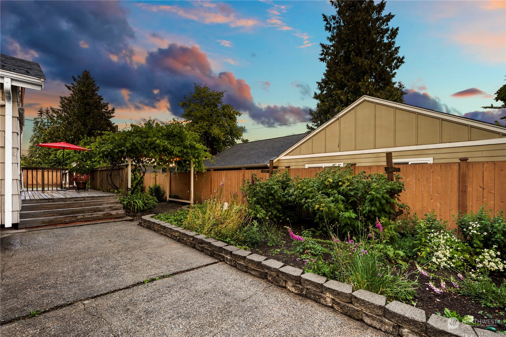 417 Ave H Snohomish, WA 98290 - Photo 29 of 37 a view of a street with potted plants and a large tree