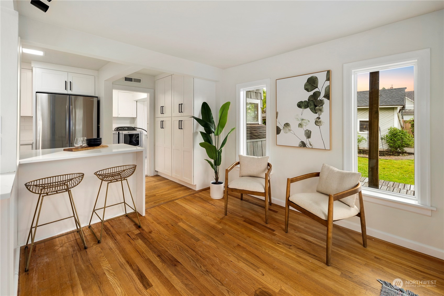 417 Ave H Snohomish, WA 98290 - Photo 6 of 37 a living room with furniture a wooden floor and next to a window