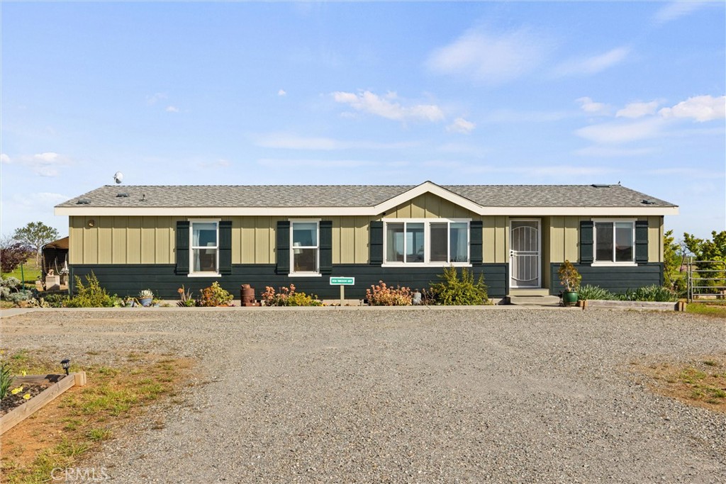 19350 Timbercove Drive Corning, CA 96021 - Photo 1 of 60 a front view of a house with outdoor seating