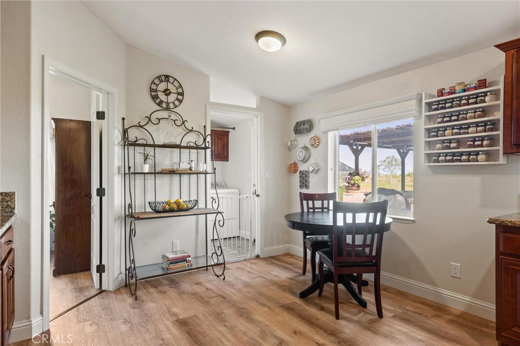 19350 Timbercove Drive Corning, CA 96021 - Photo 17 of 60 a view of a dining room with furniture window and wooden floor