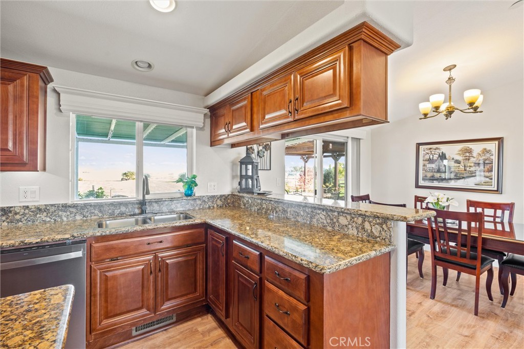 19350 Timbercove Drive Corning, CA 96021 - Photo 20 of 60 a kitchen with stainless steel appliances granite countertop a stove a sink and a microwave