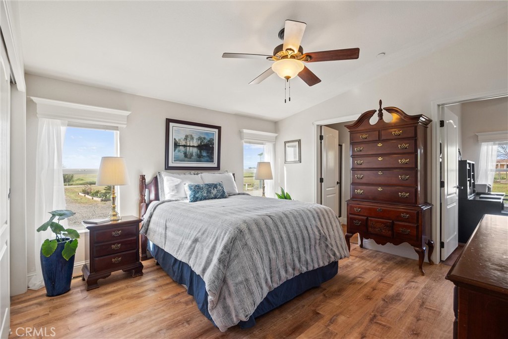 19350 Timbercove Drive Corning, CA 96021 - Photo 24 of 60 a bedroom with a bed chandelier and a closet