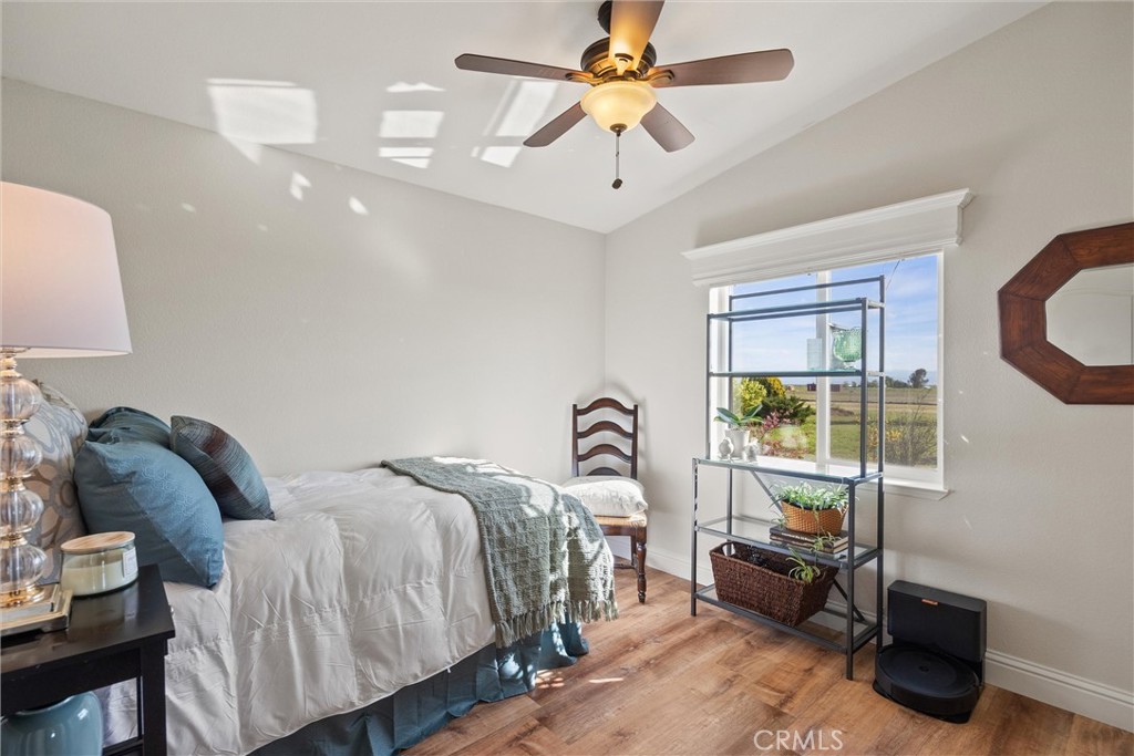 19350 Timbercove Drive Corning, CA 96021 - Photo 29 of 60 a bedroom with a bed couch and window
