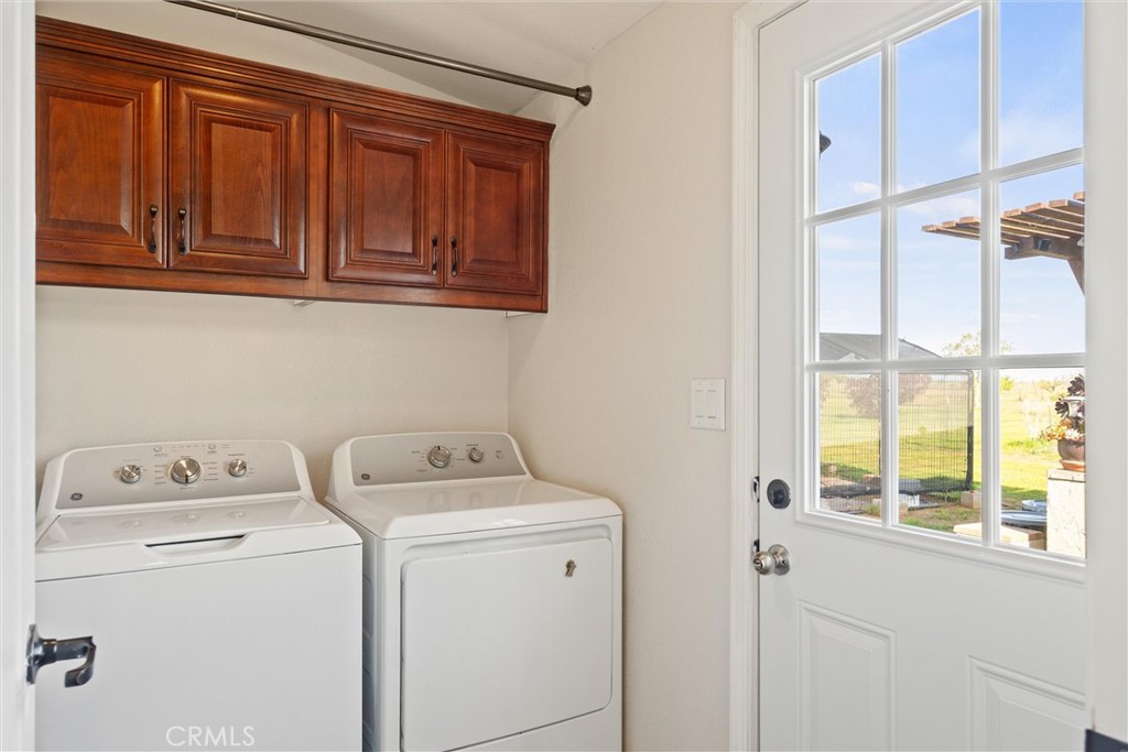 19350 Timbercove Drive Corning, CA 96021 - Photo 33 of 60 a utility room with dryer and washer