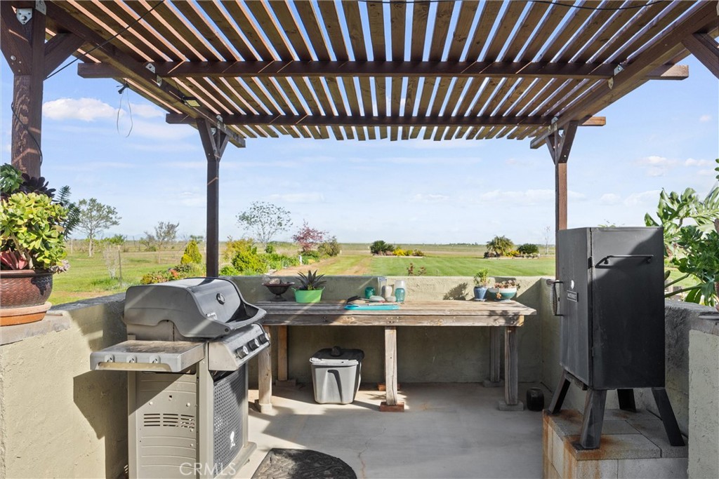 19350 Timbercove Drive Corning, CA 96021 - Photo 36 of 60 a roof deck with table and chairs and potted plants