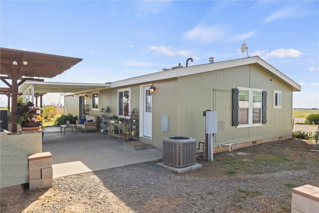 19350 Timbercove Drive Corning, CA 96021 - Photo 37 of 60 a view of a patio with table and chairs and potted plants