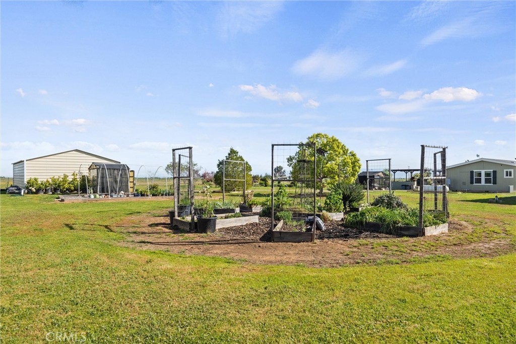19350 Timbercove Drive Corning, CA 96021 - Photo 42 of 60 a swimming pool with outdoor seating and garden