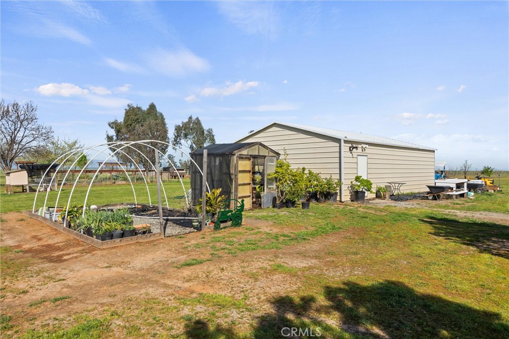 19350 Timbercove Drive Corning, CA 96021 - Photo 43 of 60 a view of a house with a big yard and potted plants