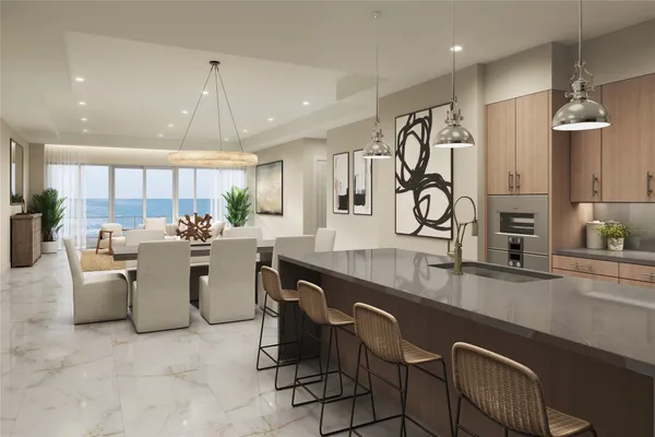 a large kitchen with lots of counter space a sink appliances and a counter top space