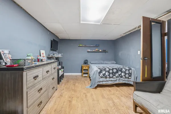 a bedroom with furniture and window