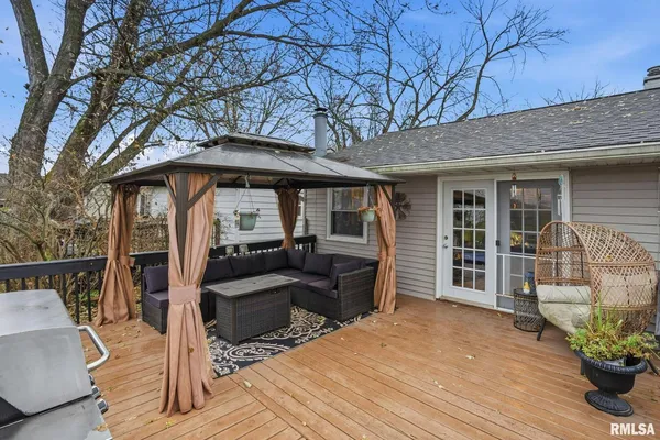 a front view of a house with glass top table and chairs