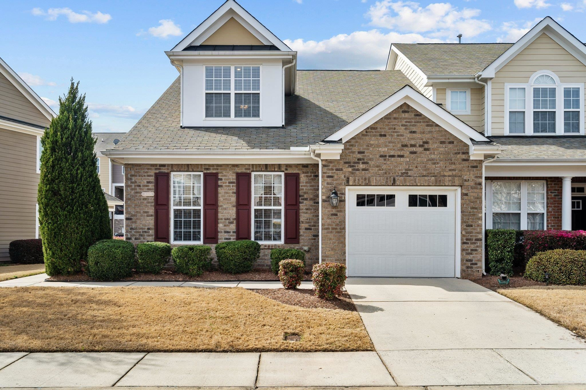 10109 Falls Meadow Court Raleigh, NC 27617 - Photo 1 of 37 a front view of a house with garden
