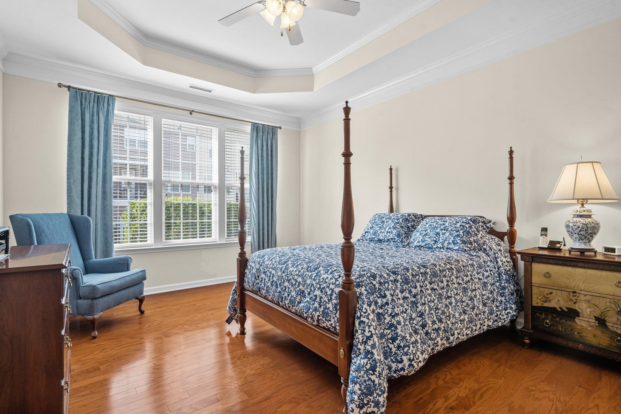 10109 Falls Meadow Court Raleigh, NC 27617 - Photo 15 of 37 a bedroom with a bed and wooden floor