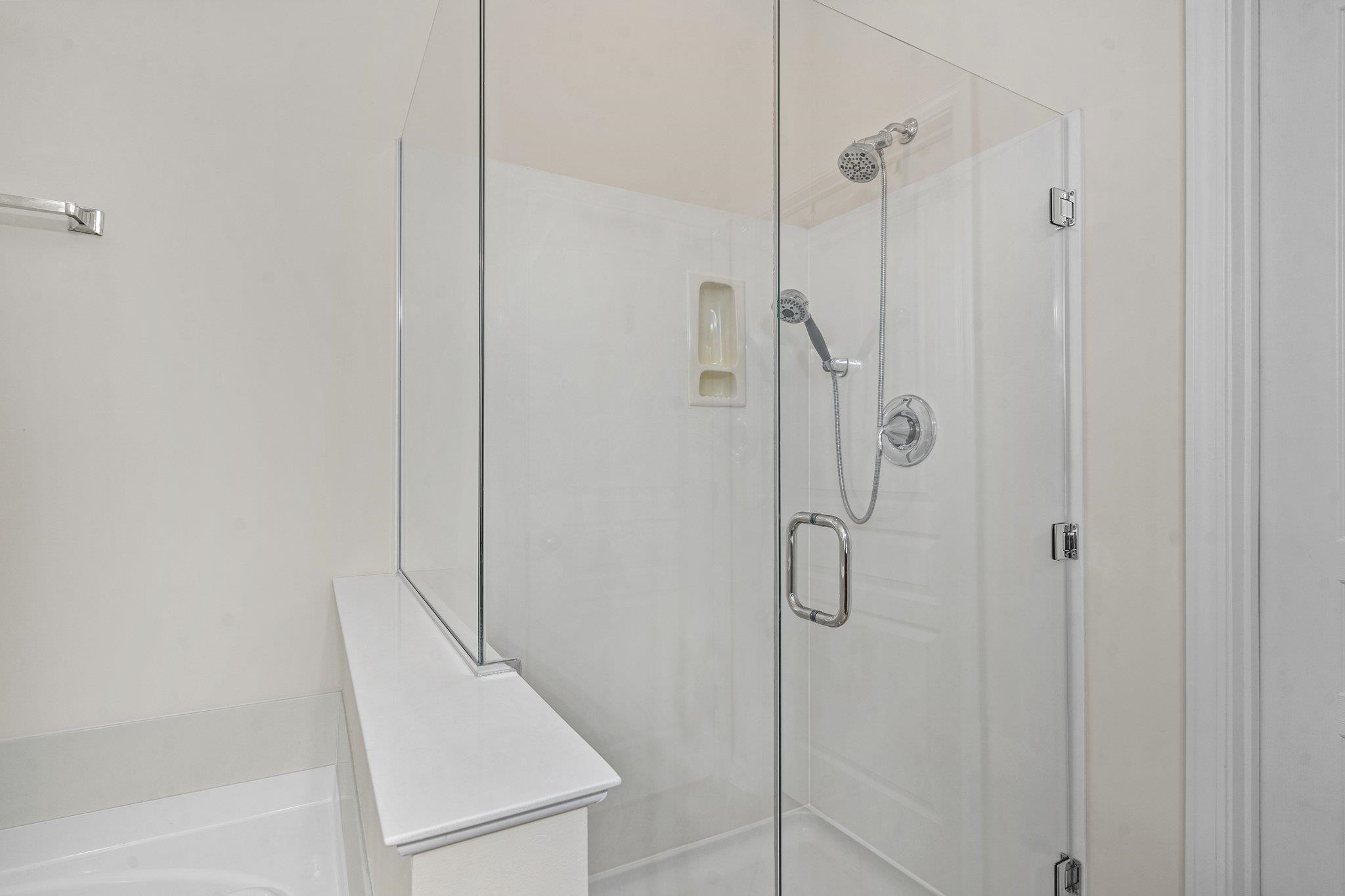 10109 Falls Meadow Court Raleigh, NC 27617 - Photo 18 of 37 a bathroom with a shower