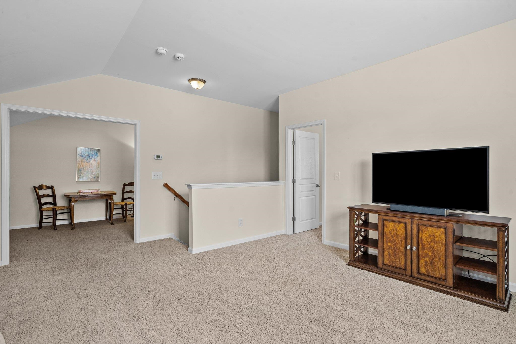 10109 Falls Meadow Court Raleigh, NC 27617 - Photo 24 of 37 a living room with furniture and a flat screen tv