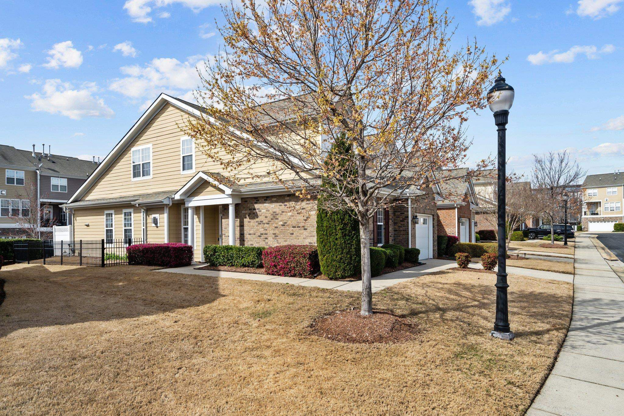 10109 Falls Meadow Court Raleigh, NC 27617 - Photo 3 of 37 a front view of a house with a yard covered in snow