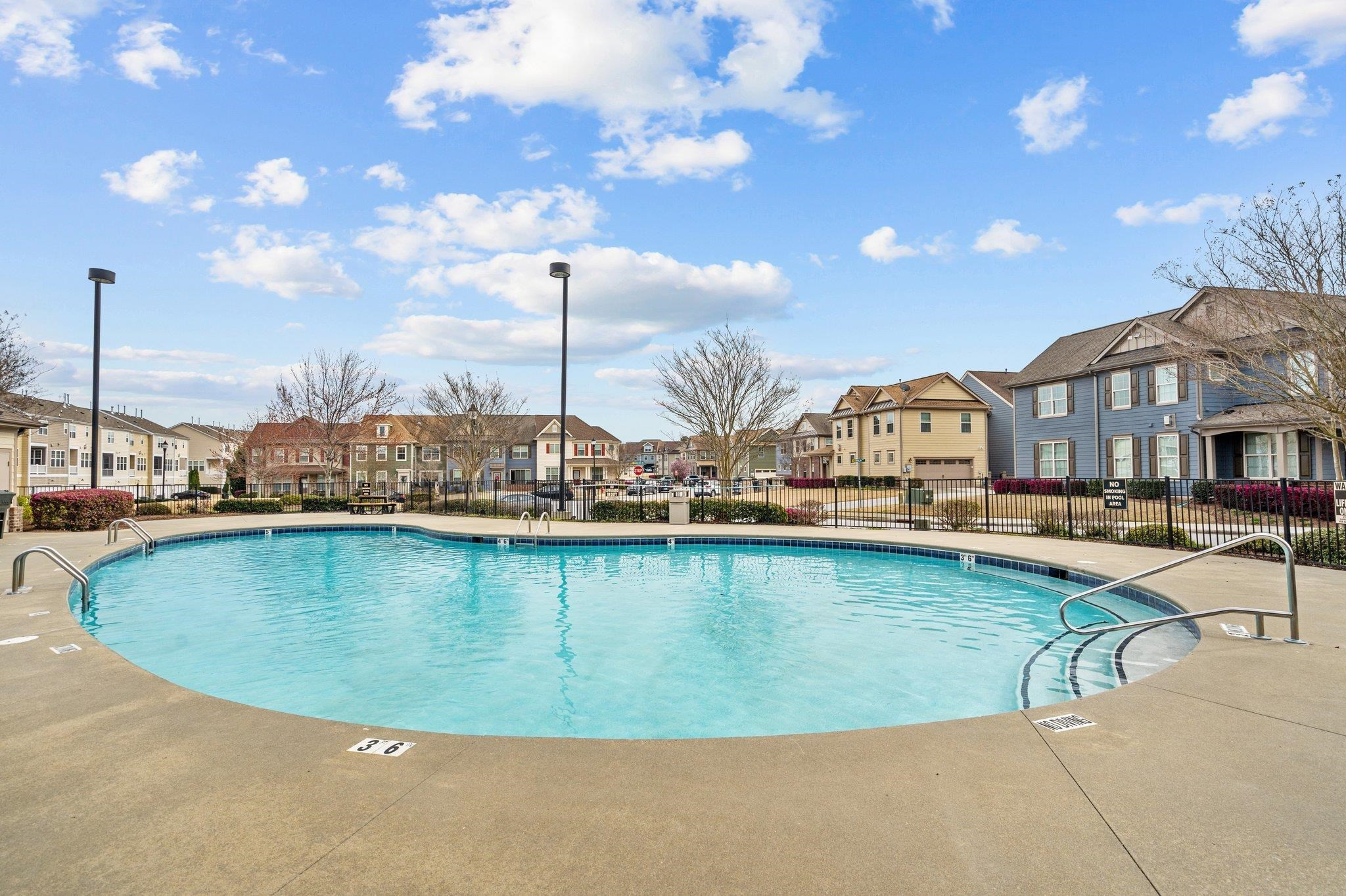 10109 Falls Meadow Court Raleigh, NC 27617 - Photo 35 of 37 a view of a swimming pool with chairs