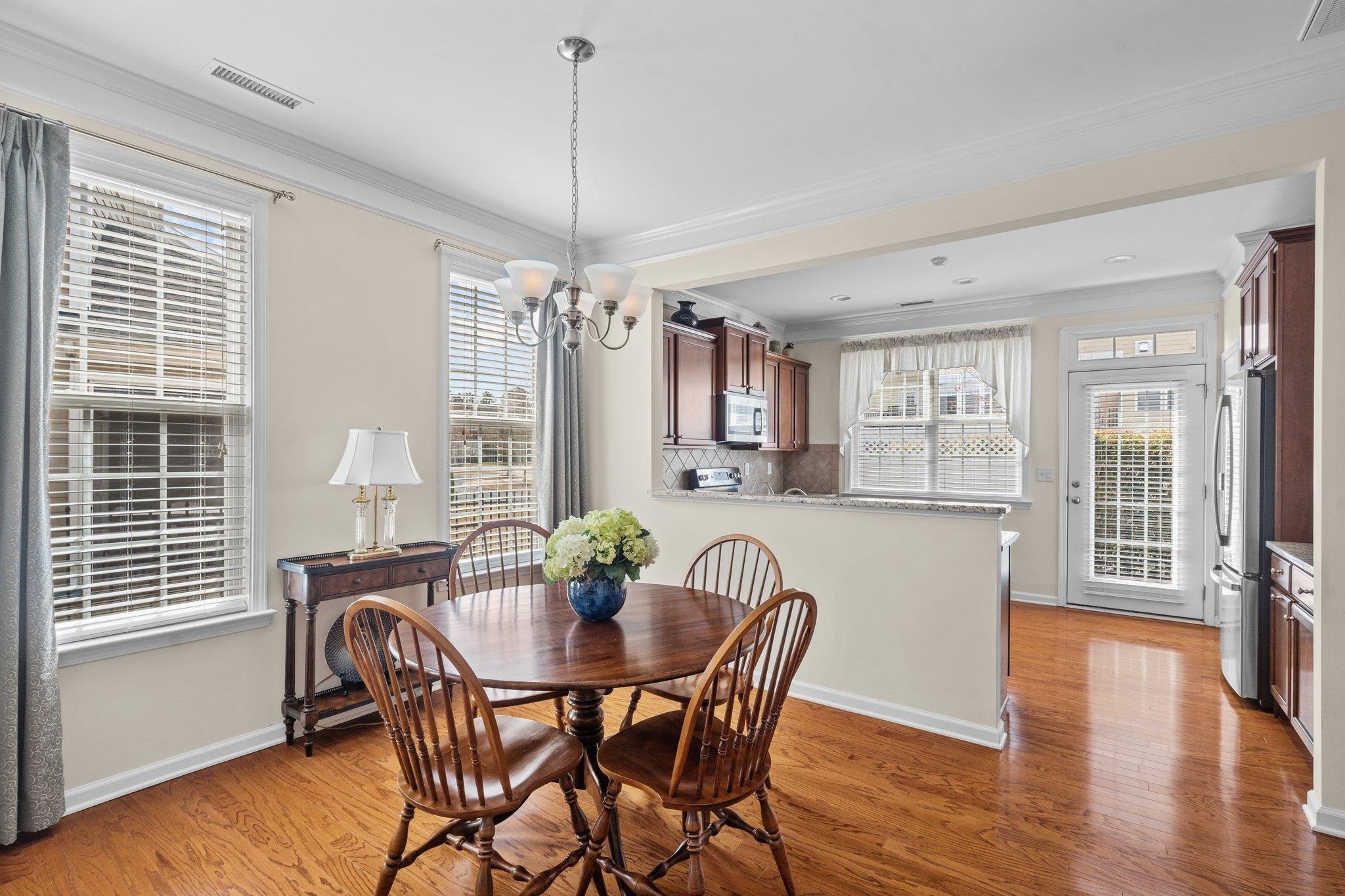 10109 Falls Meadow Court Raleigh, NC 27617 - Photo 10 of 37 a view of a dining room with furniture window and wooden floor