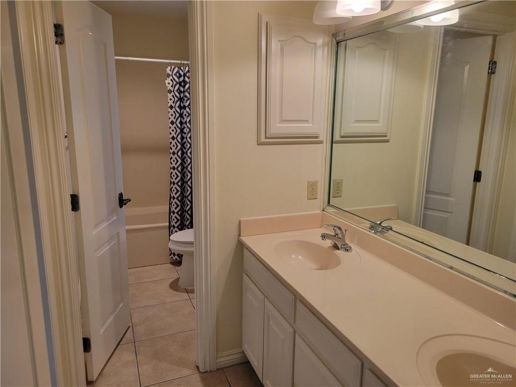 1605 Melissa Rae Drive Mission, TX 78572 - Photo 11 of 27 a bathroom with a sink a toilet and shower