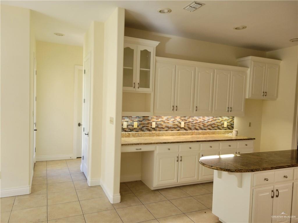 1605 Melissa Rae Drive Mission, TX 78572 - Photo 20 of 27 a kitchen with a sink and cabinets