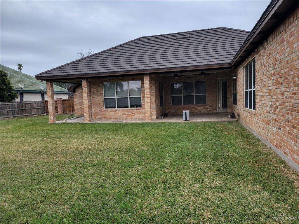 1605 Melissa Rae Drive Mission, TX 78572 - Photo 22 of 27 a front view of a house with a garden and trees
