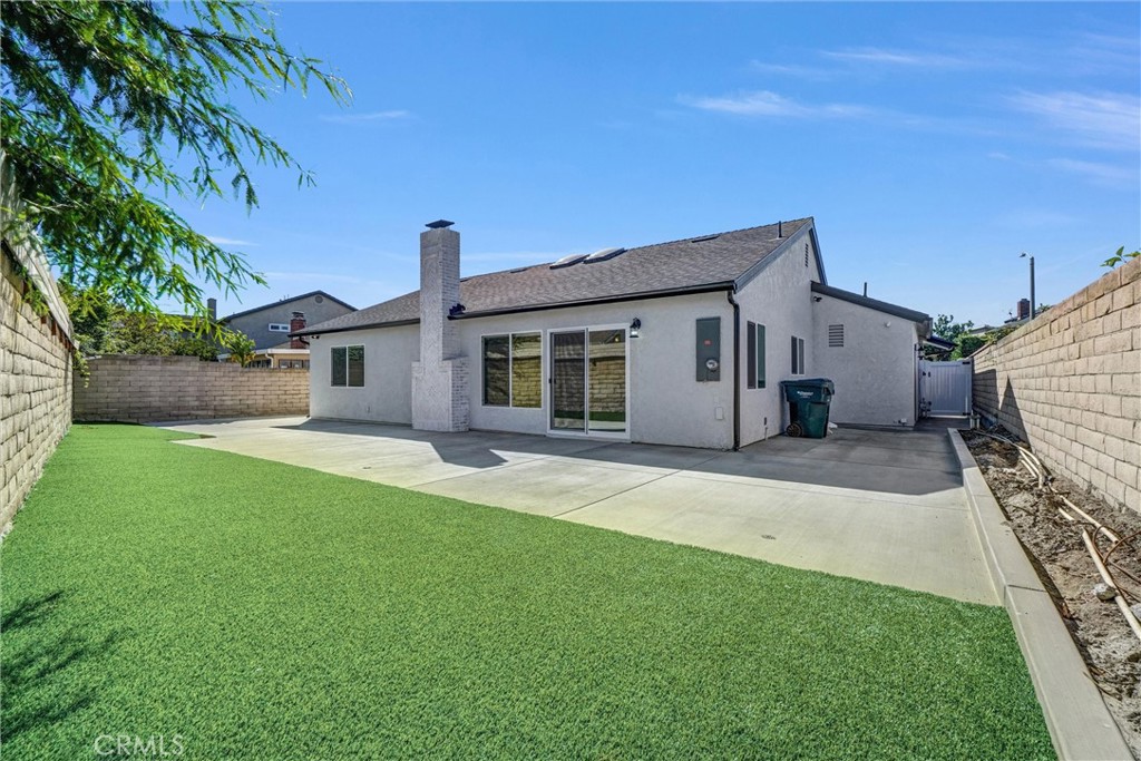 17472 Bellport Circle Huntington Beach, CA 92649 - Photo 18 of 23 a front view of a house with a yard