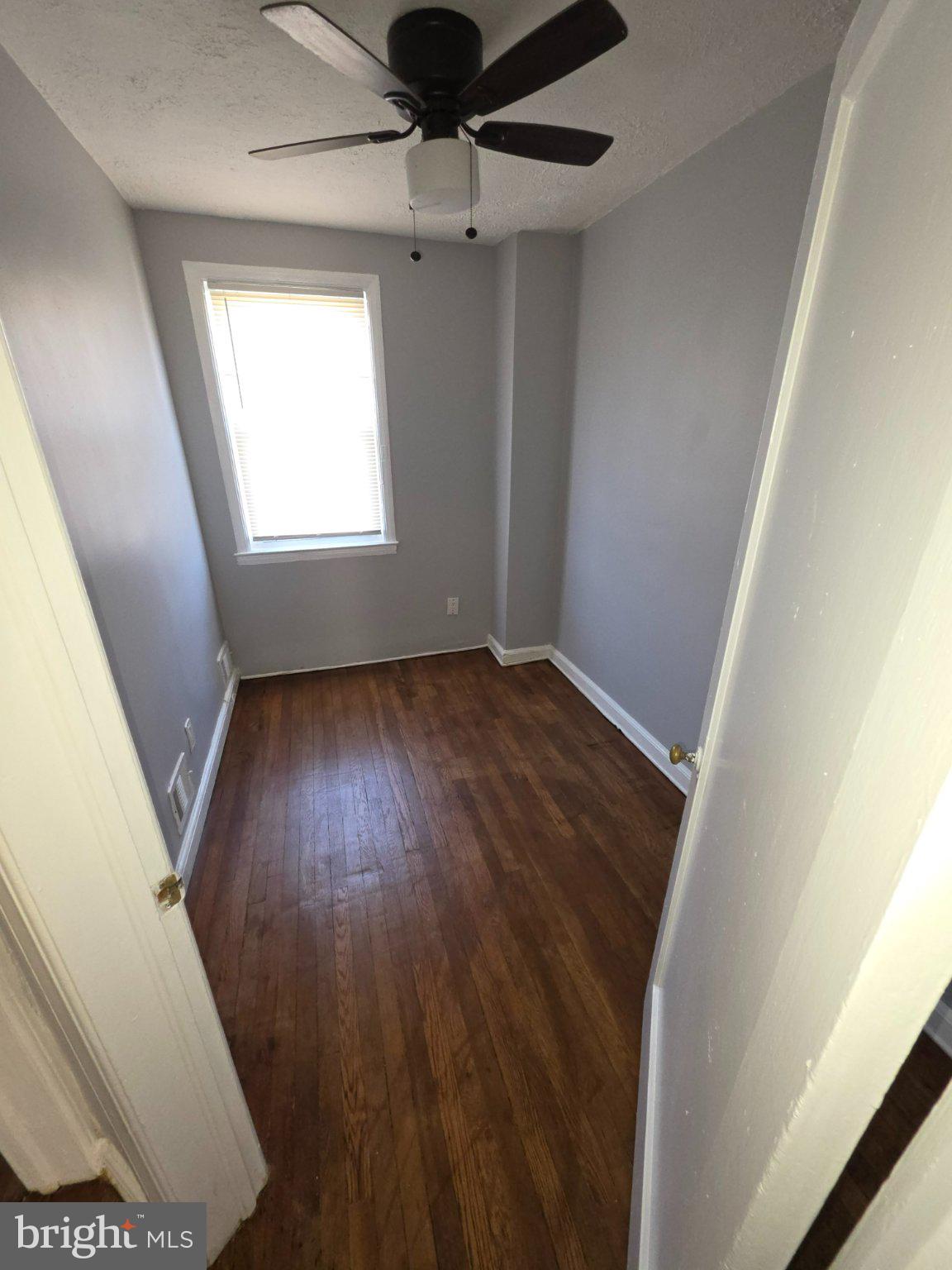 4404 Mountview Road Baltimore, MD 21229 - Photo 12 of 22 wooden floor in an empty room with a window