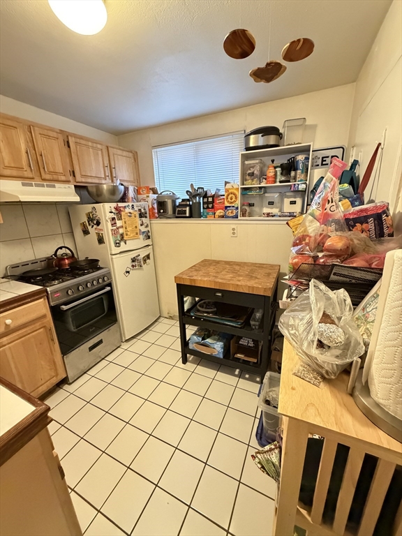 108 Perkins Street, Unit 4 Boston, MA 02130 - Photo 2 of 7 a room with gym equipment and wooden floor
