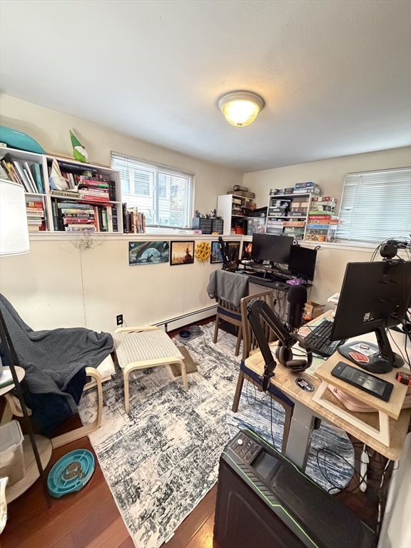 108 Perkins Street, Unit 4 Boston, MA 02130 - Photo 5 of 7 a living room with furniture and a wooden floor