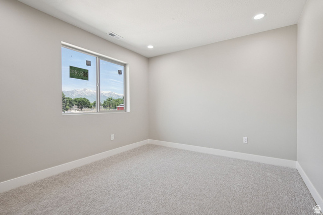 1471 Colbey Loop Santa Clara, UT 84765 - Photo 26 of 45 Bright secondary bedroom featuring neutral wall finishes, recessed ceiling lighting, and expansive carpet flooring