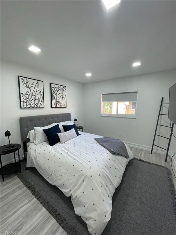 136 Harrison Road, Unit L3 Naples, FL 34112 - Photo 17 of 31 a bedroom with bed and window