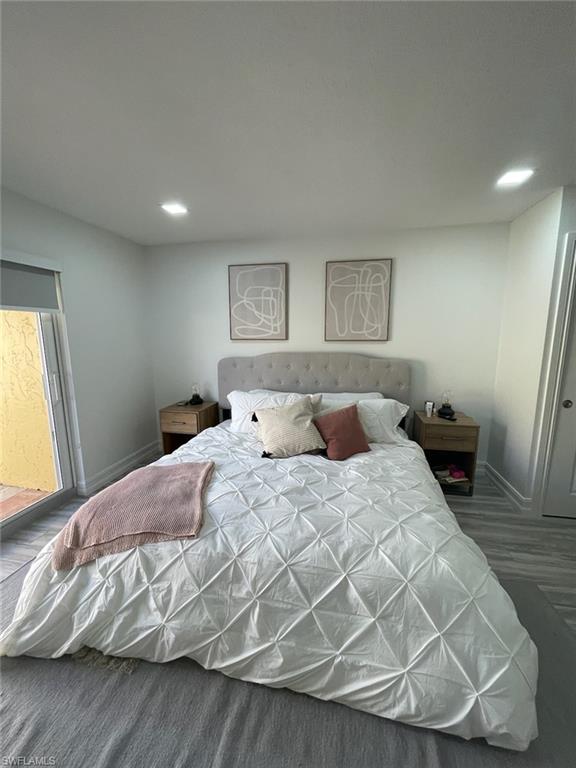 136 Harrison Road, Unit L3 Naples, FL 34112 - Photo 25 of 31 a bedroom with a bed and a window