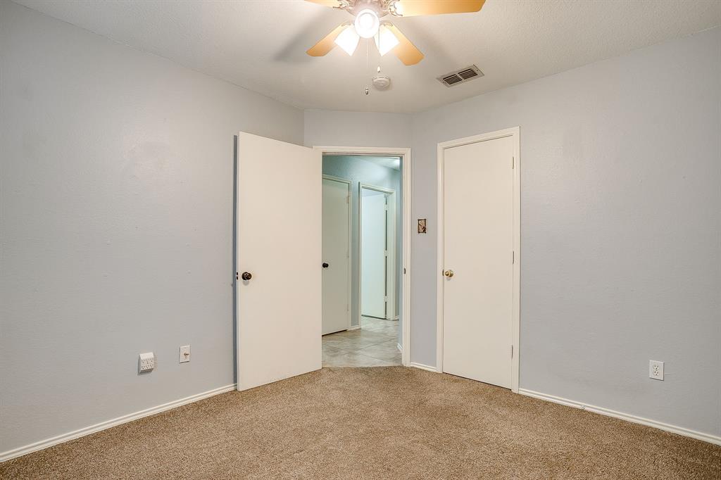 5712 Springtide Drive Fort Worth, TX 76135 - Photo 21 of 25 Bedroom 3 nearby bedroom 2 and full bath 2