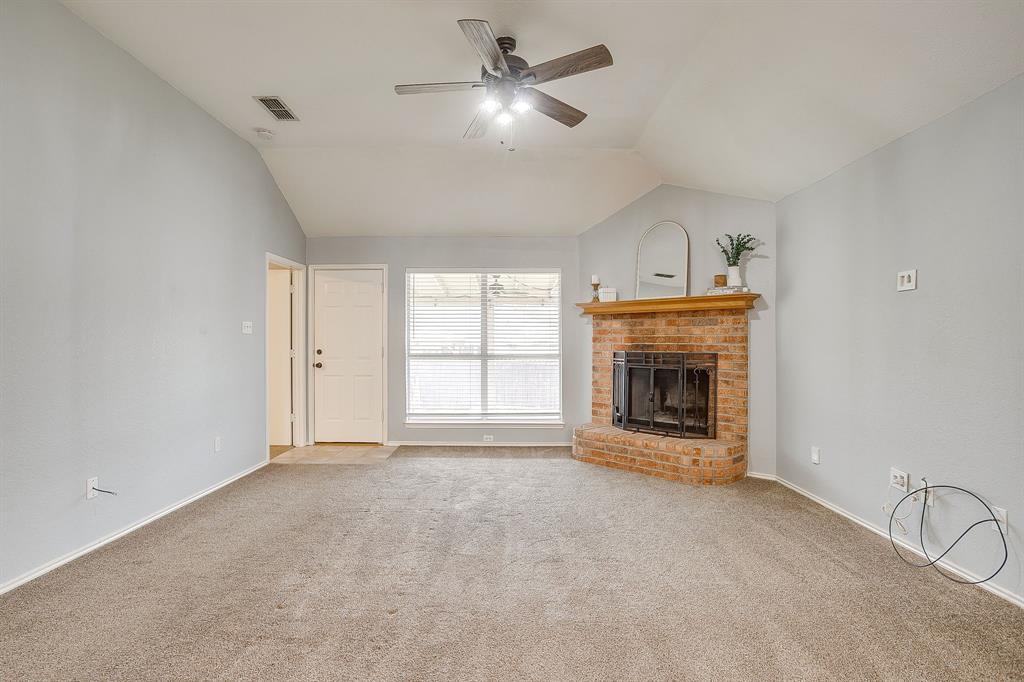 5712 Springtide Drive Fort Worth, TX 76135 - Photo 5 of 25 Back patio access and view of covered patio from living area