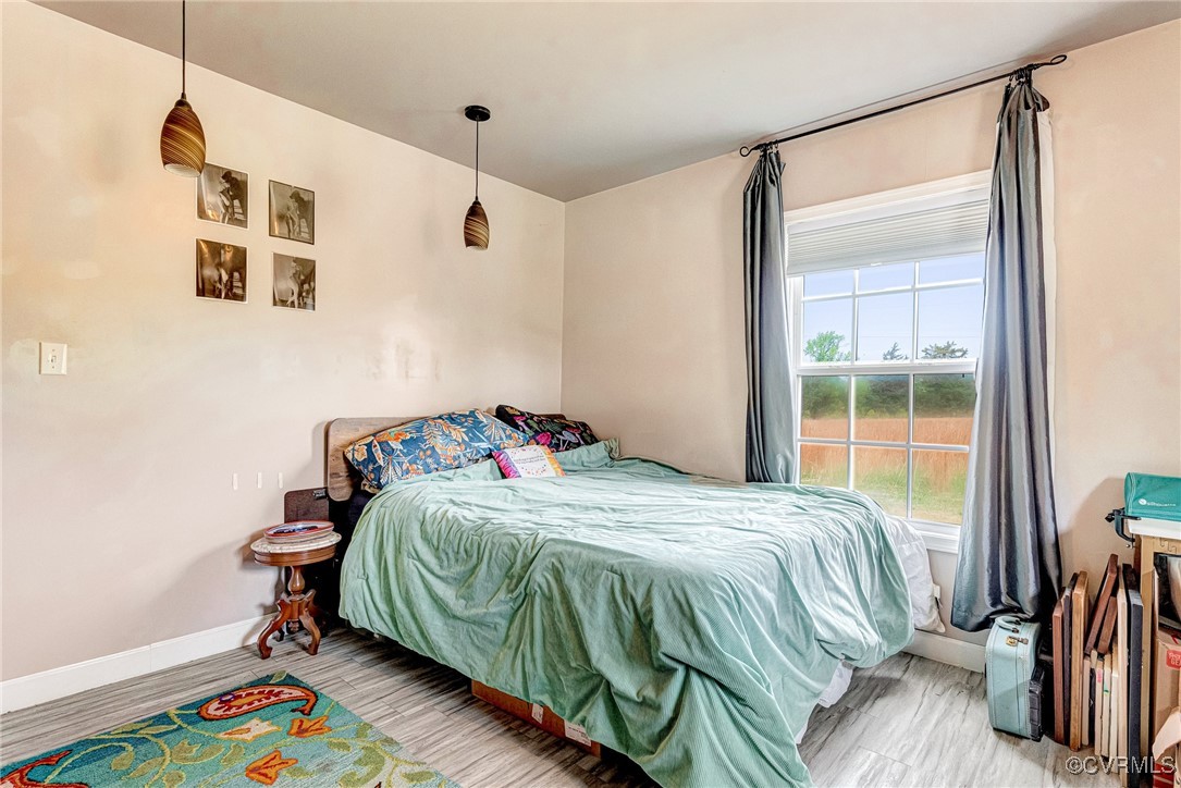 654 Bybee Road Louisa, VA 23093 - Photo 38 of 50 a bedroom with a bed and a window