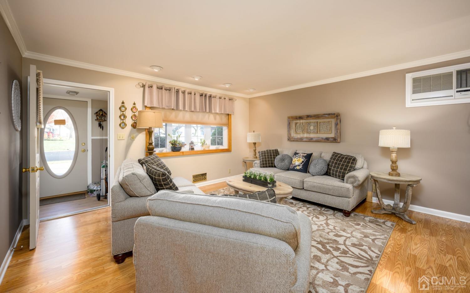 85 Idlewild Road Edison, NJ 08817 - Photo 1 of 28 a living room with furniture and a window