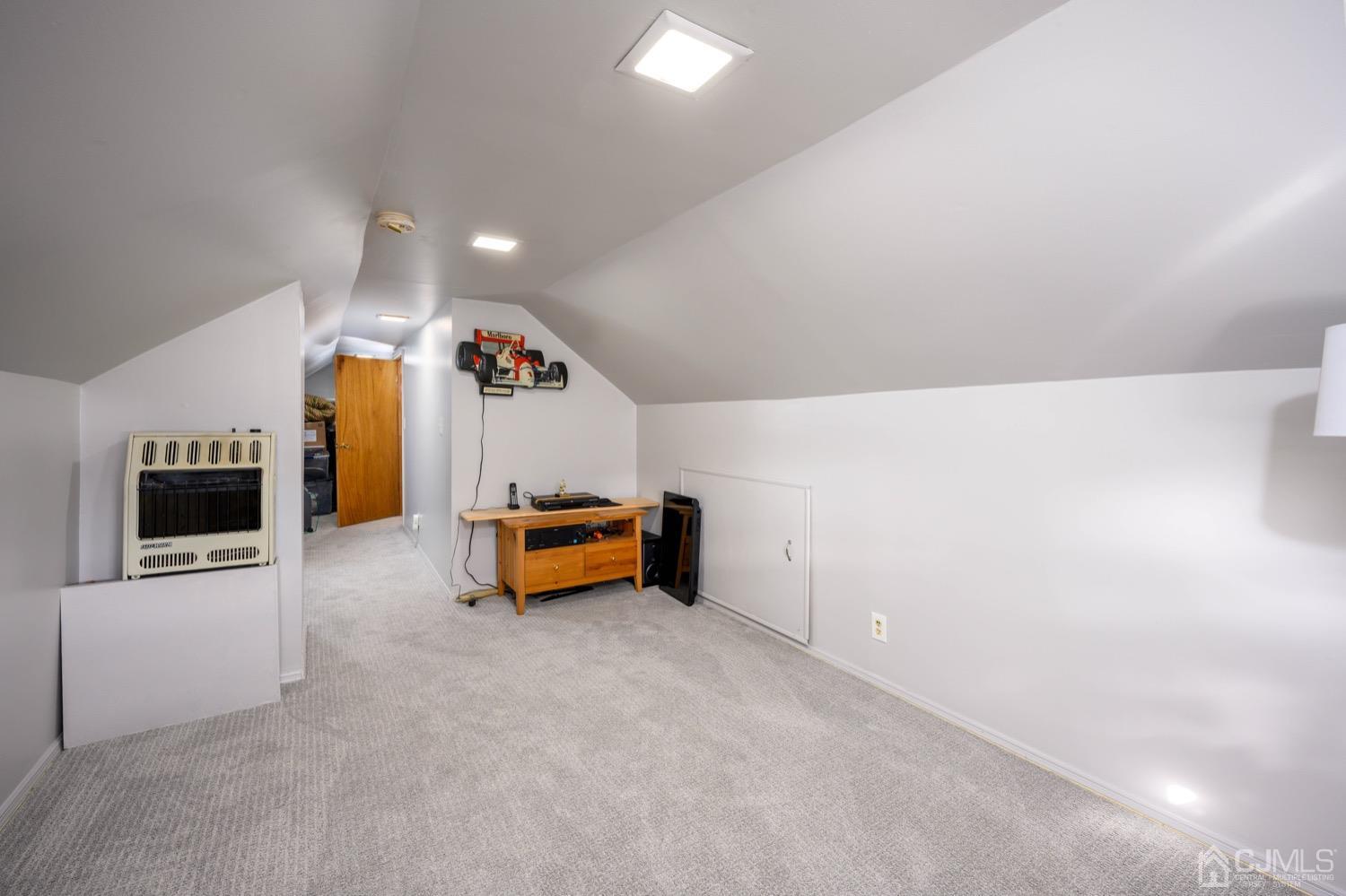 85 Idlewild Road Edison, NJ 08817 - Photo 11 of 28 a room with furniture and a flat screen tv