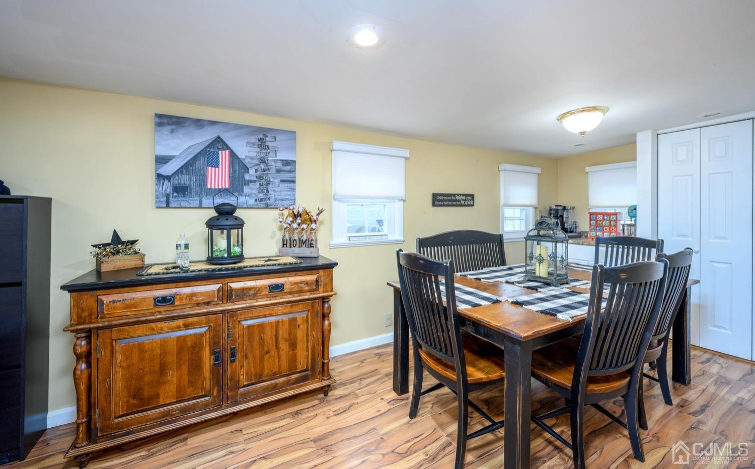 85 Idlewild Road Edison, NJ 08817 - Photo 14 of 28 a view of a dining room with furniture and wooden floor