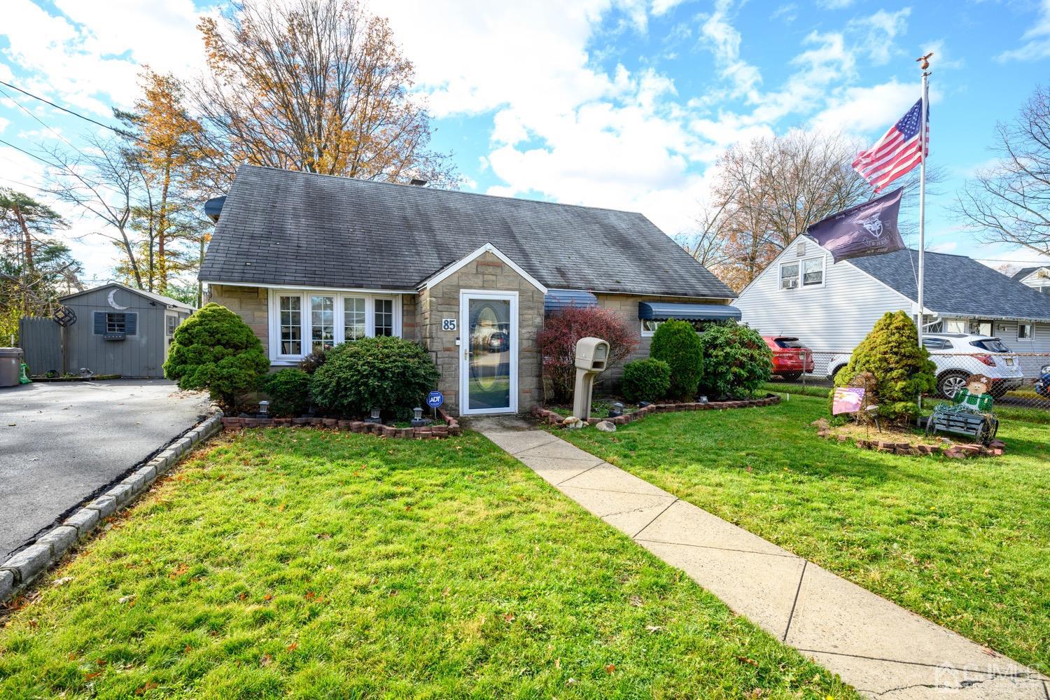85 Idlewild Road Edison, NJ 08817 - Photo 18 of 28 a front view of a house with garden