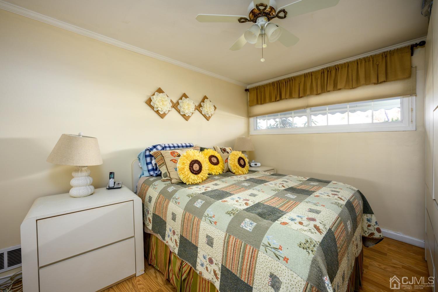 85 Idlewild Road Edison, NJ 08817 - Photo 6 of 28 a bedroom with a bed and a chandelier