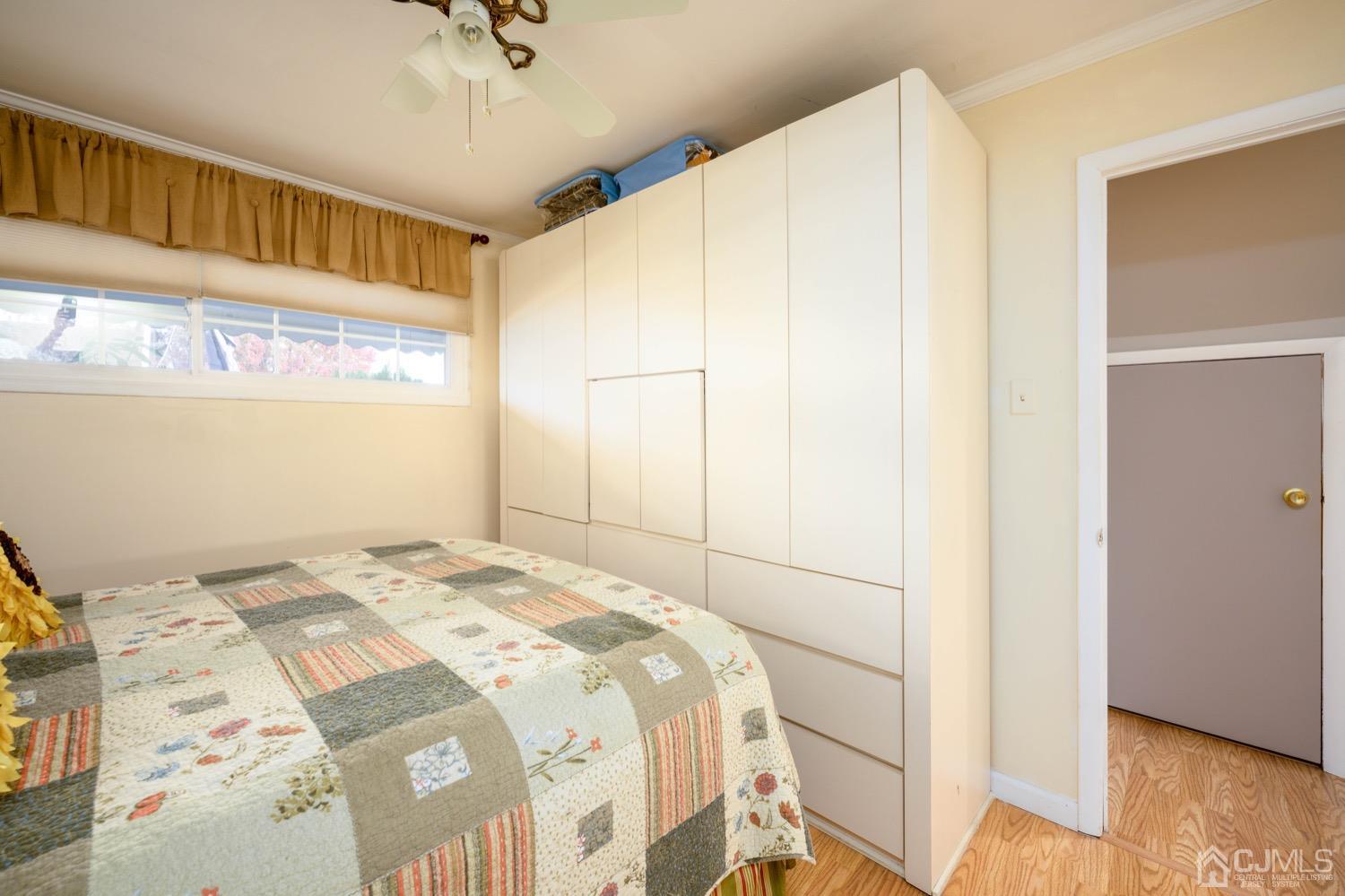 85 Idlewild Road Edison, NJ 08817 - Photo 7 of 28 a bedroom with a bed and a walk in closet