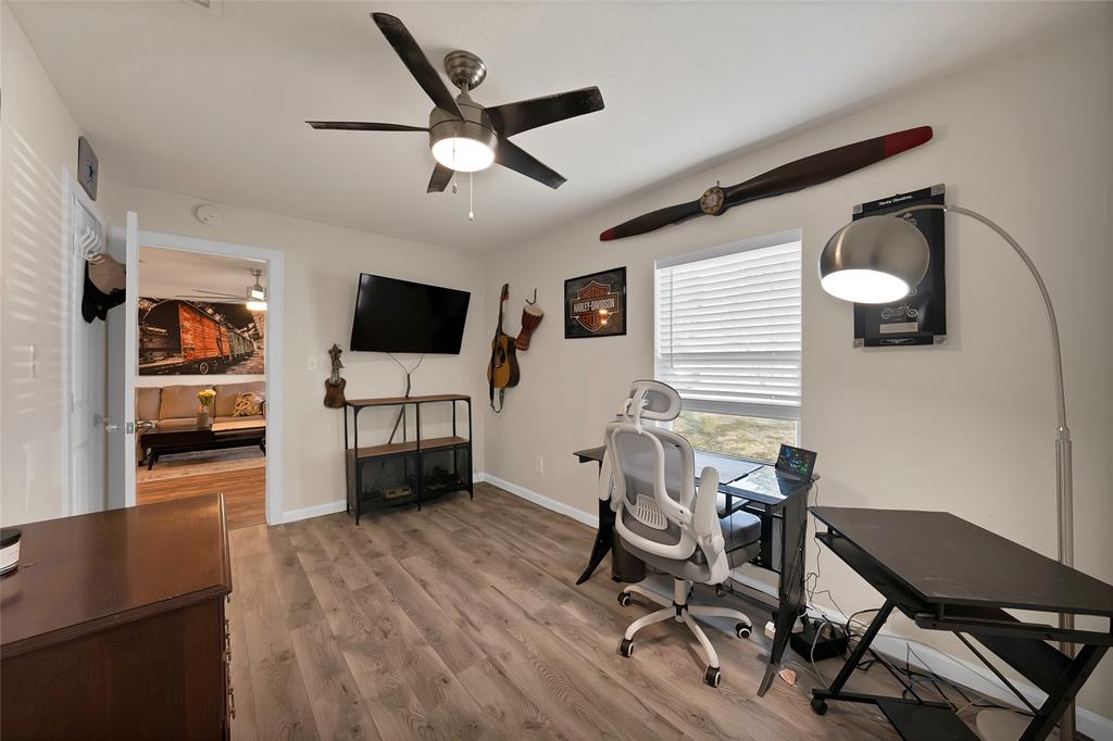 604 Moore Street Garland, TX 75040 - Photo 11 of 26 a view of a livingroom with furniture and a flat screen tv