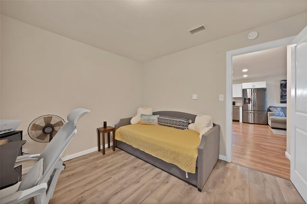 604 Moore Street Garland, TX 75040 - Photo 15 of 26 a living room with furniture and a wooden floor