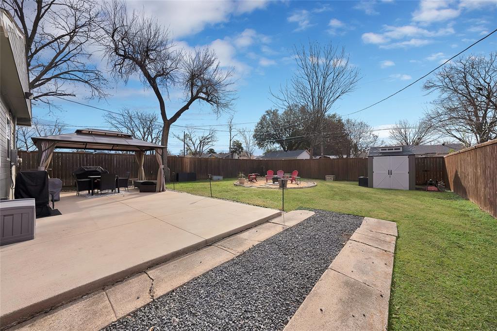 604 Moore Street Garland, TX 75040 - Photo 23 of 26 a view of a backyard with a garden
