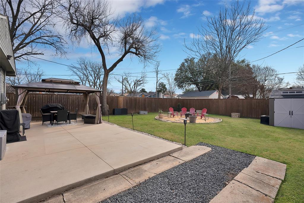 604 Moore Street Garland, TX 75040 - Photo 24 of 26 a view of backyard and fire pit