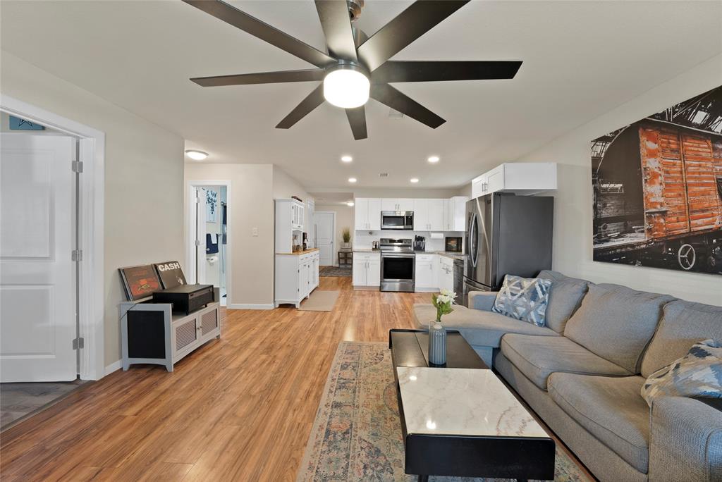 604 Moore Street Garland, TX 75040 - Photo 3 of 26 a living room with furniture and kitchen view