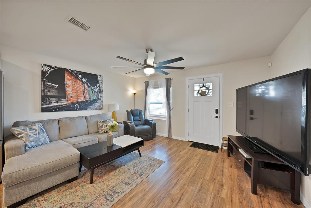 604 Moore Street Garland, TX 75040 - Photo 9 of 26 a living room with furniture and a flat screen tv